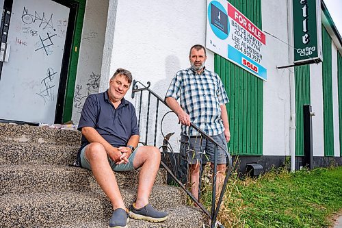 NIC ADAM / FREE PRESS
Thistle Curling Club&#x2019;s Secretary Trevor De Ryck and his brother and club president Brad De Ryck pictured outside the former club building on Burnell St. Tuesday.
240827 - Tuesday, August 27, 2024.

Reporter: Aaron