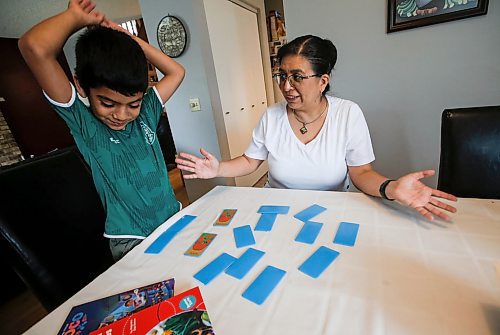 JOHN WOODS / FREE PRESS
Aline Tezcucano, who immigrated from Mexico in 2003, and her seven year old son Riley play a spanish word game in their home Monday, August 26, 2024. Tezcucano is teaching her son spanish.

Reporter: ?