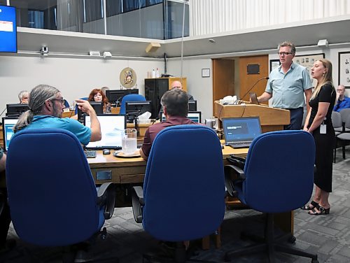 Coun. Kris Desjarlais (Ward 2) asks a question of the City of Brandon's director of strategic infrastructure Jennifer Coey and general manager of development services Mark Allard as they stand at the podium during a special council meeting on Wednesday. (Colin Slark/The Brandon Sun)