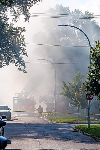 MIKE DEAL / FREE PRESS
Winnipeg Fire Paramedic Service crews work at putting out a fire that has destroyed at least two houses and badly damaged another on Cobourg Avenue between Glenwood Crescent and Beatrice Street Wednesday morning.
240828 - Wednesday, August 28, 2024.