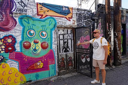 EVA WASNEY / FREE PRESS
Denver Graffiti Tour guide Will shows off a hidden mural in the RiNo Arts District. 