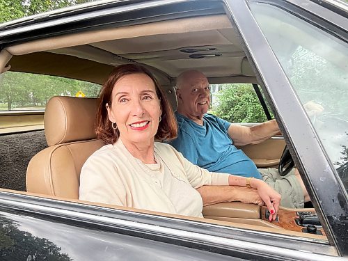 Darlene Hildebrand and Steve Van Vlaenderen are all smiles as they take possession of a 1988 Jaguar XJS convertible V-12 in Brandon on Thursday. (Photos by Michele McDougall/The Brandon Sun)