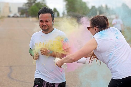 A runner receives the full treatment during Thursday's event. (Tim Smith/The Brandon Sun)