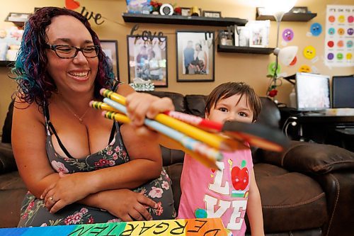 MIKE DEAL / FREE PRESS
Tannis with her son, Ben Silver, 4, who is holding out the collection of pencils that he got in today&#x2019;s calendar slot.
Tannis Silver, a teacher and mother, is getting ready to send her youngest, Ben, to kindergarten next week. She says Ben has been more hesitant about starting school than his older siblings. In order to get him excited, she's created a colourful countdown to kindergarten. 
The four-year-old is opening the equivalent of an advent calendar; every day, there's a new school-related item to open and put in his backpack. 
Reporter: Maggie Macintosh
240829 - Thursday, August 29, 2024.