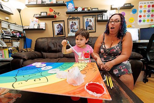 MIKE DEAL / FREE PRESS
Tannis with her son, Ben Silver, 4, who is opening today&#x2019;s calendar slot which is full of various types of pencils.
Tannis Silver, a teacher and mother, is getting ready to send her youngest, Ben, to kindergarten next week. She says Ben has been more hesitant about starting school than his older siblings. In order to get him excited, she's created a colourful countdown to kindergarten. 
The four-year-old is opening the equivalent of an advent calendar; every day, there's a new school-related item to open and put in his backpack. 
Reporter: Maggie Macintosh
240829 - Thursday, August 29, 2024.