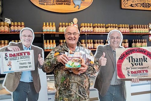 BROOK JONES ./ FREE PRESS
Danny Kleinsasser, 62, of Danny's Whole Hog Barbecue &amp; Smokehouse holds a variety of packaged meats as he stands in the family's retail store at 12045 PTH 67 in the RM of Rockwood, Man., Thursday, Aug. 29, 2024.