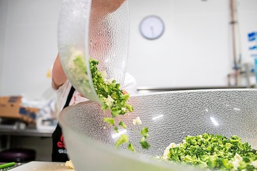 BROOK JONES ./ FREE PRESS
Cassidy Kleinsasser, 14, who is the youngest daughter of Danny Kleinsasser of Danny's Whole Hog Barbecue &amp; Smokehouse is pictured making a broccoli and cauliflower salade at the family's operation at 12045 PTH 67 in the RM of Rockwood, Man., Thursday, Aug. 29, 2024.