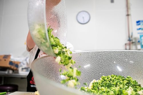 BROOK JONES ./ FREE PRESS
Cassidy Kleinsasser, 14, who is the youngest daughter of Danny Kleinsasser of Danny's Whole Hog Barbecue &amp; Smokehouse is pictured making a broccoli and cauliflower salade at the family's operation at 12045 PTH 67 in the RM of Rockwood, Man., Thursday, Aug. 29, 2024.