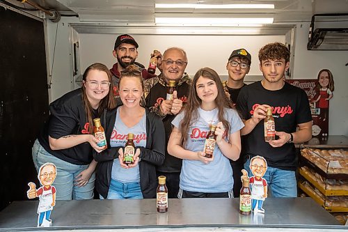 BROOK JONES ./ FREE PRESS
Danny Kleinsasser (back row second from far left) of Danny's Whole Hog Barbecue &amp; Smokehouse is pictured with family and staff inside a food truck at the family's operation at 12045 PTH 67 in the RM of Rockwood, Man., Thursday, Aug. 29, 2024. Back Row: L-R: Isaiah Kleinsasser, 25, Danny Kleinsasser, 62, Nehemiah Kleinsasser, 16 and Ezra Kleinsasser, 18. Front Row: L-R: Dayna Van Steelant, 20, Kourtenay Schlamp, 34 and Cassidy Kleinsasser, 14.