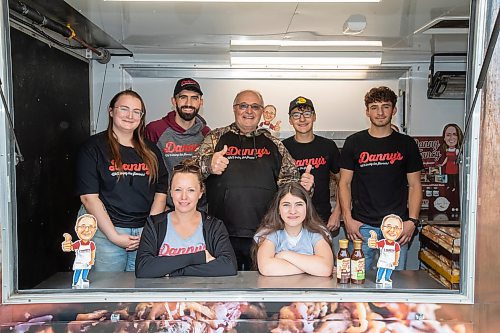 BROOK JONES ./ FREE PRESS
Danny Kleinsasser (back row: middle) of Danny's Whole Hog Barbecue &amp; Smokehouse is pictured with family and staff inside a food truck at the family's operation at 12045 PTH 67 in the RM of Rockwood, Man., Thursday, Aug. 29, 2024. Back Row: L-R: Dayna Van Steelant, 20, Isaiah Kleinsasser, 25, Danny Kleinsasser, 62, Nehemiah Kleinsasser, 16 and Ezra Kleinsasser, 18. Front Row: L-R: Kourtenay Schlamp, 34 and Cassidy Kleinsasser, 14.