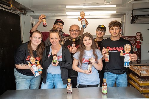 BROOK JONES ./ FREE PRESS
Danny Kleinsasser (back row second from far left) of Danny's Whole Hog Barbecue &amp; Smokehouse is pictured with family and staff inside a food truck at the family's operation at 12045 PTH 67 in the RM of Rockwood, Man., Thursday, Aug. 29, 2024. Back Row: L-R: Isaiah Kleinsasser, 25, Danny Kleinsasser, 62, Nehemiah Kleinsasser, 16 and Ezra Kleinsasser, 18. Front Row: L-R: Dayna Van Steelant, 20, Kourtenay Schlamp, 34 and Cassidy Kleinsasser, 14.