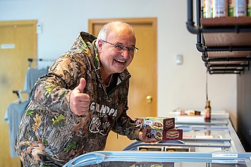 BROOK JONES ./ FREE PRESS
Danny Kleinsasser, 62, of Danny's Whole Hog Barbecue &amp; Smokehouse gives thumbs up as he puts a variety of packaged meats into a freezer while he stands in the family's retail store at 12045 PTH 67 in the RM of Rockwood, Man., Thursday, Aug. 29, 2024.