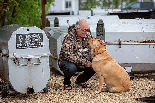 BROOK JONES ./ FREE PRESS
Danny Kleinsasser, 62,  (middle) of Danny Kleinsasser of Danny's Whole Hog Barbecue &amp; Smokehouse is pictured with his three-year-old yellow labrador retriever at the family's operation at 12045 PTH 67 in the RM of Rockwood, Man., Thursday, Aug. 29, 2024.