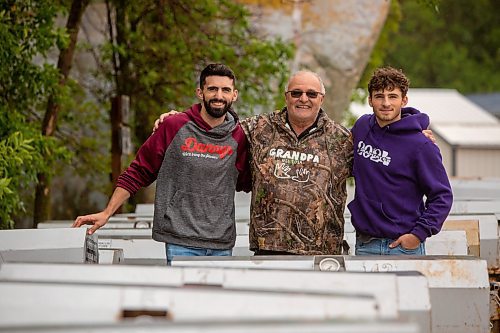 BROOK JONES ./ FREE PRESS
Danny Kleinsasser, 62,  (middle) of Danny Kleinsasser of Danny's Whole Hog Barbecue &amp; Smokehouse and his sons Isaiah Kleinsasser, 25, (left) and Ezra Kleinsasser, 18, (right) are surrounded by cookers as they are pictured at the family's operation at 12045 PTH 67 in the RM of Rockwood, Man., Thursday, Aug. 29, 2024.