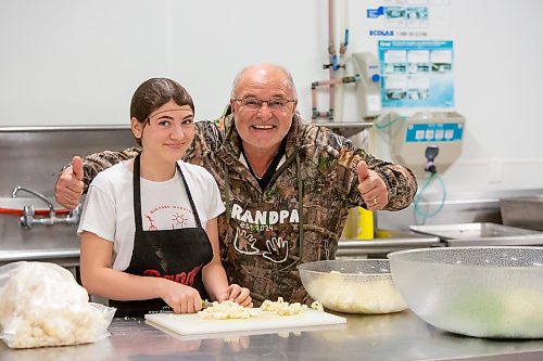 BROOK JONES ./ FREE PRESS
Danny Kleinsasser (right) of Danny's Whole Hog Barbecue &amp; Smokehouse is pictured with his youngest daughter Cassidy Kleinsasser, 14, at the family's operation at 12045 PTH 67 in the RM of Rockwood, Man., Thursday, Aug. 29, 2024.