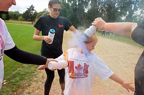 29082024
Nine-year-old Sloane Dumas is covered in coloured powder during the CFB Shilo Fun Run 2024 hosted by CFB Shilo Community Recreation and Shilo MFRC. Donations were taken for cancer research as part of the run and a free barbecue was served after. 
(Tim Smith/The Brandon Sun)