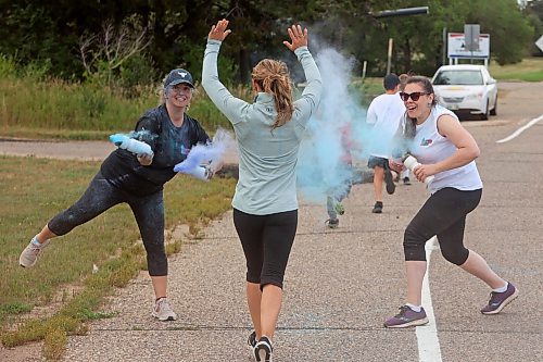 29082024
Paula Planetta and Janelle Boyd with PSP Shilo cover runners with coloured powder during the CFB Shilo Fun Run 2024 hosted by CFB Shilo Community Recreation and the Shilo Military Family Resource Centre. Donations were taken for cancer research as part of the run and a free barbecue was served after. 
(Tim Smith/The Brandon Sun)