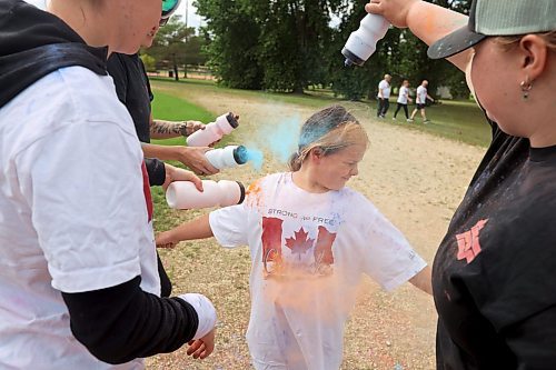 29082024
Nine-year-old Sloane Dumas is covered in coloured powder during the CFB Shilo Fun Run 2024 hosted by CFB Shilo Community Recreation and Shilo MFRC. Donations were taken for cancer research as part of the run and a free barbecue was served after. 
(Tim Smith/The Brandon Sun)