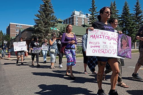 Participants take part in the Overdose Awareness Day walk in downtown Brandon on Friday. The walk began and ended at Princess Park and was followed by speakers and a lunch.  (Tim Smith/The Brandon Sun)