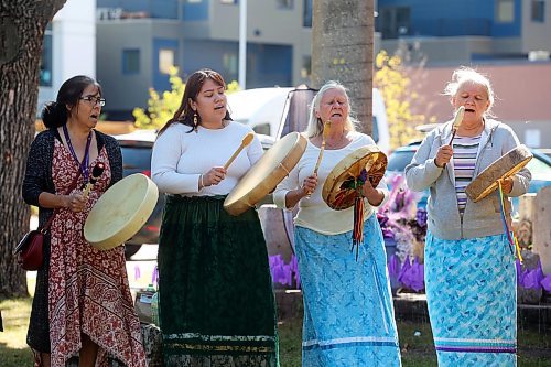 Drummers Brenda Nugent, Annalee Flett, Audrey Graham and Deborah Tacan perform a wildflower song prior to the Overdose Awareness Day walk in downtown Brandon on Friday. (Tim Smith/The Brandon Sun)