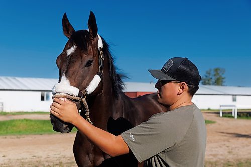 MIKE DEAL / FREE PRESS
Trainer Steve Keplin, Jr. with horse Exacting at Assiniboia Downs Friday morning.
Reporter: George Williams
240830 - Friday, August 30, 2024.