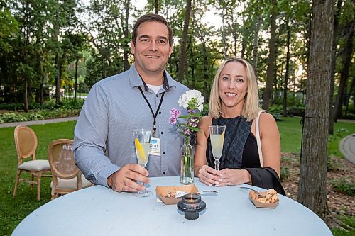 BROOK JONES / FREE PRESS
Friends Matt Outhwaite (left) and Kelsey Wiebe, who are are also colleagues Shelter Canadian Properties Ltd., are pictured at A Picnic in Provence - Garden Party 2024 at the Leo Mol Sculpture Garden at Assiniboine Park in Winnipeg, Man., Wednesday, Aug. 28, 2024. The annual fundraiser supports the Assiniboine Park Conservancy and this year's event included 500 guests.