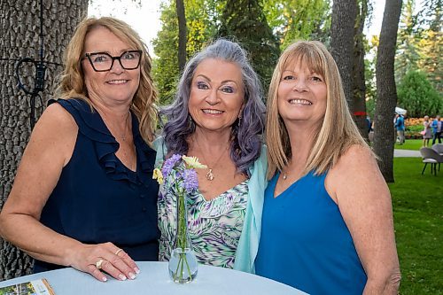 BROOK JONES / FREE PRESS
From left: Maxine MacLennan, Ann Martin and Lori Davies at A Picnic in Provence - Garden Party 2024 at the Leo Mol Sculpture Garden at Assiniboine Park in Winnipeg, Man., Wednesday, Aug. 28, 2024. The annual fundraiser supports the Assiniboine Park Conservancy and this year's event included 500 guests.