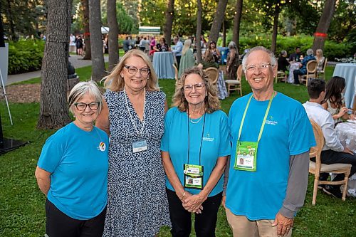 BROOK JONES / FREE PRESS
From left: Assiniboine Park Conservancy volunteers Barb Ediger, Laverne Dahlin, Donna Wilford and Richard Winton are pictured at A Picnic in Provence - Garden Party 2024 at the Leo Mol Sculpture Garden at Assiniboine Park in Winnipeg, Man., Wednesday, Aug. 28, 2024. The annual fundraiser supports the Assiniboine Park Conservancy and this year's event included 500 guests.