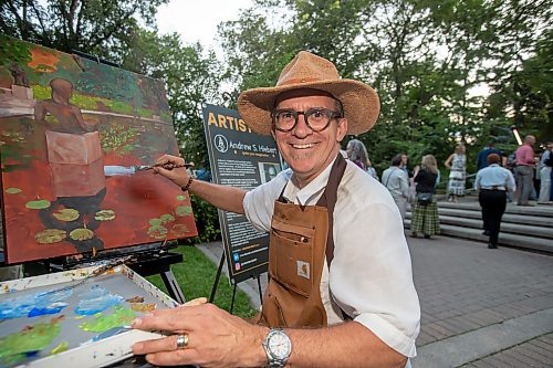 BROOK JONES / FREE PRESS
Artist Andrew S. Hiebert of Ignite Your Imagination is all smiles as paints an acrylic painting during A Picnic in Provence - Garden Party 2024 at the Leo Mol Sculpture Garden at Assiniboine Park in Winnipeg, Man., Wednesday, Aug. 28, 2024. The annual fundraiser supports the Assiniboine Park Conservancy and this year's event included 500 guests.