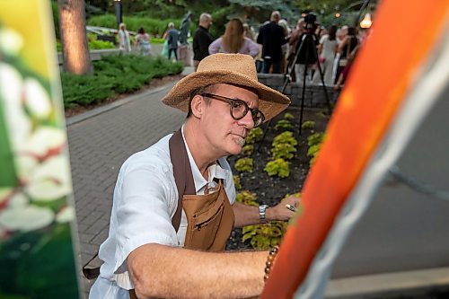 BROOK JONES / FREE PRESS
Artist Andrew S. Hiebert of Ignite Your Imagination paints an acrylic painting during A Picnic in Provence - Garden Party 2024 at the Leo Mol Sculpture Garden at Assiniboine Park in Winnipeg, Man., Wednesday, Aug. 28, 2024. The annual fundraiser supports the Assiniboine Park Conservancy and this year's event included 500 guests.