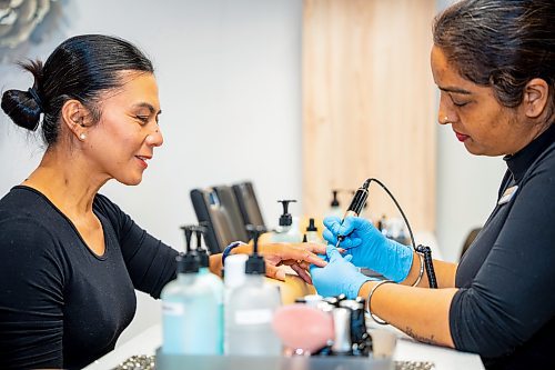 NIC ADAM / FREE PRESS
Nail tech Rajni Devi (right) gives a manicure to Aihlene Alvarado at Almond Nail Bar&#x2019;s flagship store in St. Vital.
240830 - Friday, August 30, 2024.

Reporter: Gabby