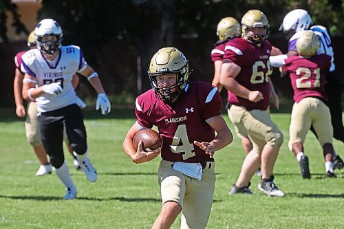 30082024
#4 of the Crocus Plainsmen runs the ball during a high school football scrimmage against the Vincent Massey Vikings at Vincent Massey High School on Friday in advance of the regular season. 
(Tim Smith/The Brandon Sun)