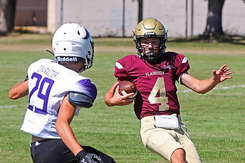 30082024
#4 of the Crocus Plainsmen tries to get the ball past #29 of the Vincent Massey Vikings during a high school football scrimmage at Vincent Massey High School on Friday in advance of the regular season. 
(Tim Smith/The Brandon Sun)