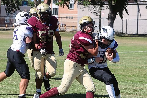 30082024
#35 of the Crocus Plainsmen tackles quarterback #10 of the Vincent Massey Vikings during a high school football scrimmage at Vincent Massey High School on Friday in advance of the regular season. 
(Tim Smith/The Brandon Sun)