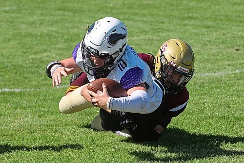 30082024
#10 of the Vincent Massey Vikings is tackled by #7 of the Crocus Plainsmen during a high school football scrimmage at Vincent Massey High School on Friday in advance of the regular season. 
(Tim Smith/The Brandon Sun)