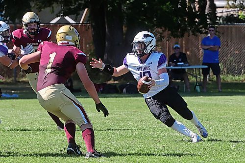 30082024
Quarterback #10 of the Vincent Massey Vikings looks to run the ball past #1 of the Crocus Plainsmen during a high school football scrimmage at Vincent Massey High School on Friday in advance of the regular season. 
(Tim Smith/The Brandon Sun)