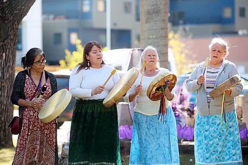 30082024
Drummers Brenda Nugent, Annalee Flett, Audrey Graham and Deborah Tacan perform a wildflower song prior to the International Toxic Drug Poisoning Awareness Day walk in downtown Brandon on Friday. The walk began and ended at Princess Park and was followed by speakers and a lunch.  (Tim Smith/The Brandon Sun)