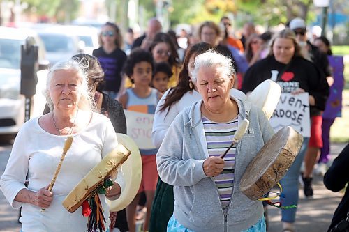 30082024
Drummers Audrey Graham and Deborah Tacan lead participants in the International Toxic Drug Poisoning Awareness Day walk in downtown Brandon on Friday. The walk began and ended at Princess Park and was followed by speakers and a lunch.  (Tim Smith/The Brandon Sun)