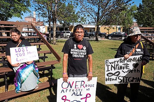 30082024
Participants listen to drummers perform a wildflower song prior to the International Toxic Drug Poisoning Awareness Day walk in downtown Brandon on Friday. The walk began and ended at Princess Park and was followed by speakers and a lunch.  (Tim Smith/The Brandon Sun)