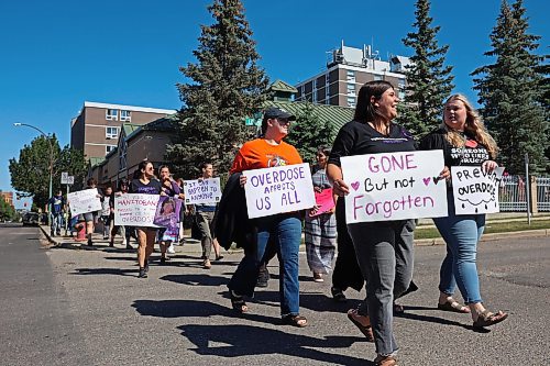 30082024
Participants take part in the International Toxic Drug Poisoning Awareness Day walk in downtown Brandon on Friday. The walk began and ended at Princess Park and was followed by speakers and a lunch.  (Tim Smith/The Brandon Sun)