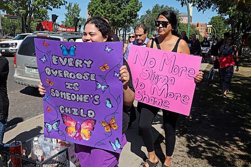 30082024
Participants take part in the International Toxic Drug Poisoning Awareness Day walk in downtown Brandon on Friday. The walk began and ended at Princess Park and was followed by speakers and a lunch.  (Tim Smith/The Brandon Sun)