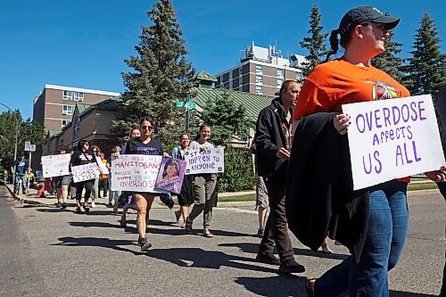 30082024
Participants take part in the International Toxic Drug Poisoning Awareness Day walk in downtown Brandon on Friday. The walk began and ended at Princess Park and was followed by speakers and a lunch.  (Tim Smith/The Brandon Sun)