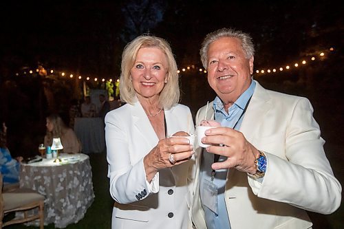 BROOK JONES / FREE PRESS
Deborah Waller (left) and her husband Simon Waller of Simon Imports Ltd., enjoy ice cream as they attend A Picnic in Provence - Garden Party 2024 at the Leo Mol Sculpture Garden at Assiniboine Park in Winnipeg, Man., Wednesday, Aug. 28, 2024. The annual fundraiser supports the Assiniboine Park Conservancy and this year's event included 500 guests.