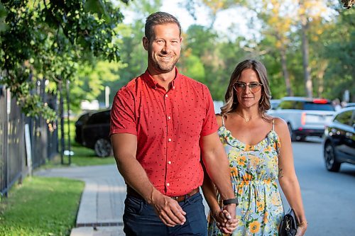 BROOK JONES / FREE PRESS
Eric Stewart (left) and his wife Desirae Stewart arrive at A Picnic in Provence - Garden Party 2024 at the Leo Mol Sculpture Garden at Assiniboine Park in Winnipeg, Man., Wednesday, Aug. 28, 2024. The annual fundraiser supports the Assiniboine Park Conservancy and this year's event included 500 guests.