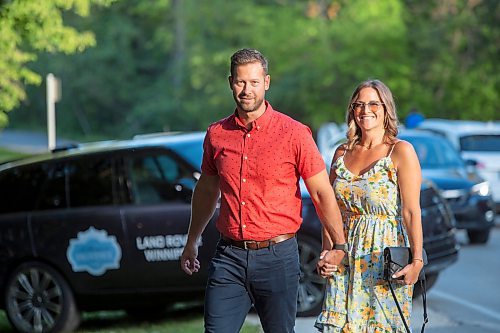 BROOK JONES / FREE PRESS
Eric Stewart (left) and his wife Desirae Stewart arrive at A Picnic in Provence - Garden Party 2024 at the Leo Mol Sculpture Garden at Assiniboine Park in Winnipeg, Man., Wednesday, Aug. 28, 2024. The annual fundraiser supports the Assiniboine Park Conservancy and this year's event included 500 guests.