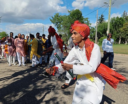 A young man is doing the Lazim dance at the inauguration parade of the BAPS Hindu temple in Brandon. (Connor McDowell/Brandon Sun)