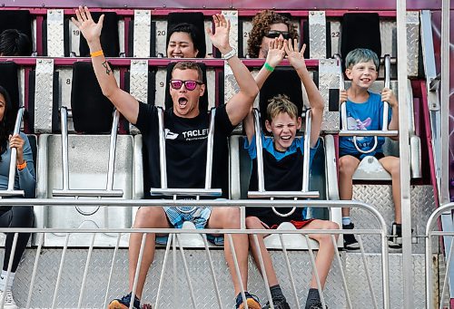 JOHN WOODS / FREE PRESS
Patrick Labossiere and son Tyson enjoy a ride on the Typhoon during the Fall Fair at Red River Exhibition Park in Winnipeg Sunday, September 1, 2024. 

Reporter: jura