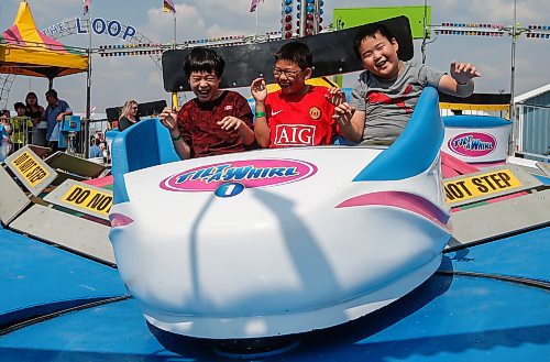 JOHN WOODS / FREE PRESS
Harper, Ariste, and Hermes enjoy a ride on Tilt-A-Wheel during the Fall Fair at Red River Exhibition Park in Winnipeg Sunday, September 1, 2024. 

Reporter: jura