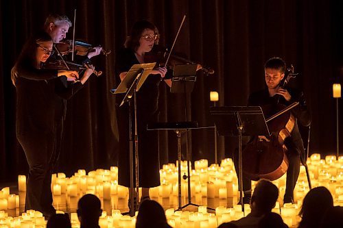 BROOK JONES / FREE PRESS
Musicians from the Listeso Music Group which include (clockwise from far left) Elation Pauls on violin, Chris Anstey on fiddle, Elise Lavall&#xe9;e on viloa and Samuel Nadurak on cello perform on stage as they are surrounded by candles during A Tribute To Coldplay as part of the Fever Candlelight Series at the Winnipeg Art Gallery in Winnipeg, Man., Friday, Aug. 30, 2024.