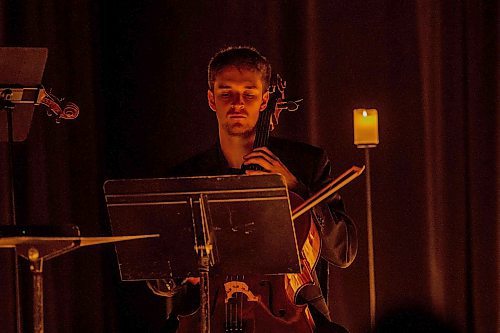 BROOK JONES / FREE PRESS
Samuel Nadurak performs on the cello during A Tribute To Coldplay as part of the Fever Candlelight Series at the Winnipeg Art Gallery in Winnipeg, Man., Friday, Aug. 30, 2024. Musicians also performing from the Listeso Music Group while surrounded by candles on stage are Elation Pauls on violin, Chris Anstey on fiddle and Elise Lavall&#xe9;e on viloa.